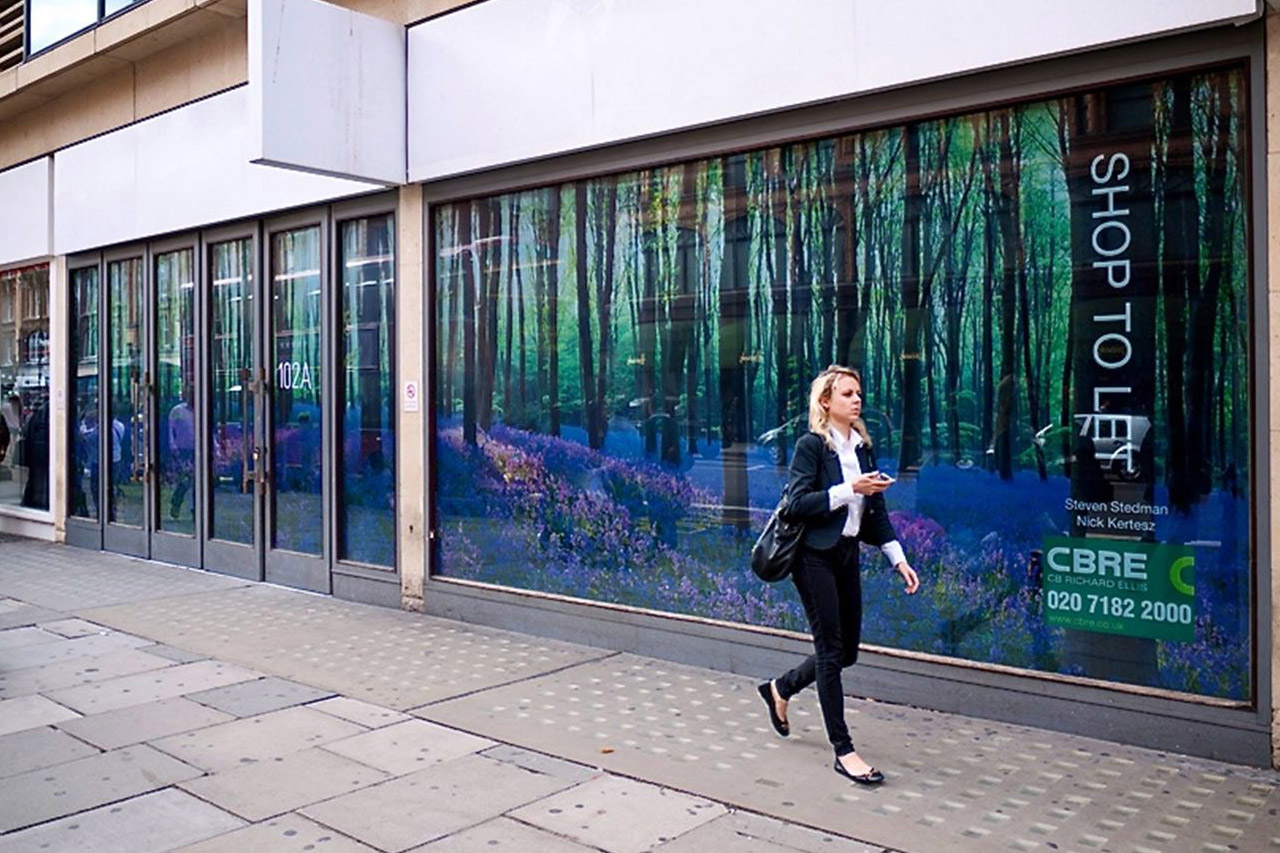 Good use of empty retail units in the city centre using images for windoe graphics